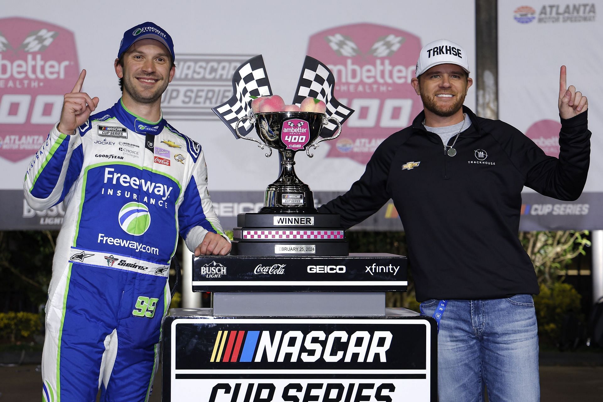 Daniel Suarez celebrates with Trackhouse Racing team co-owner, Justin Marks, after winning the 2024 NASCAR Cup Series Ambetter Health 400. Source: Getty